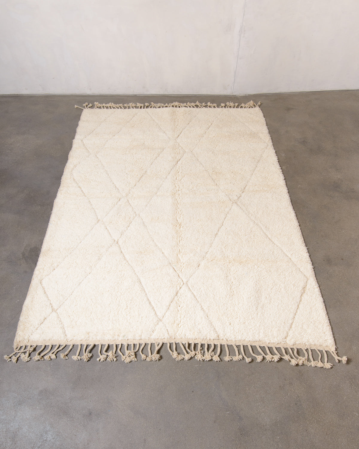 Modern, designer, handcrafted Berber rug from Morocco. Beniourain carpet with minimalist design, natural wool pile and a fluffy texture.
